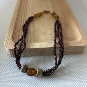 Triple strands with mix brown seed beads and lobster clasp bracelet.